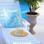 A Pinterest pin with a picture of a pillow and sun hat sitting on a chaise lounge by a pool. Designed for this post about the benefits of self-care.