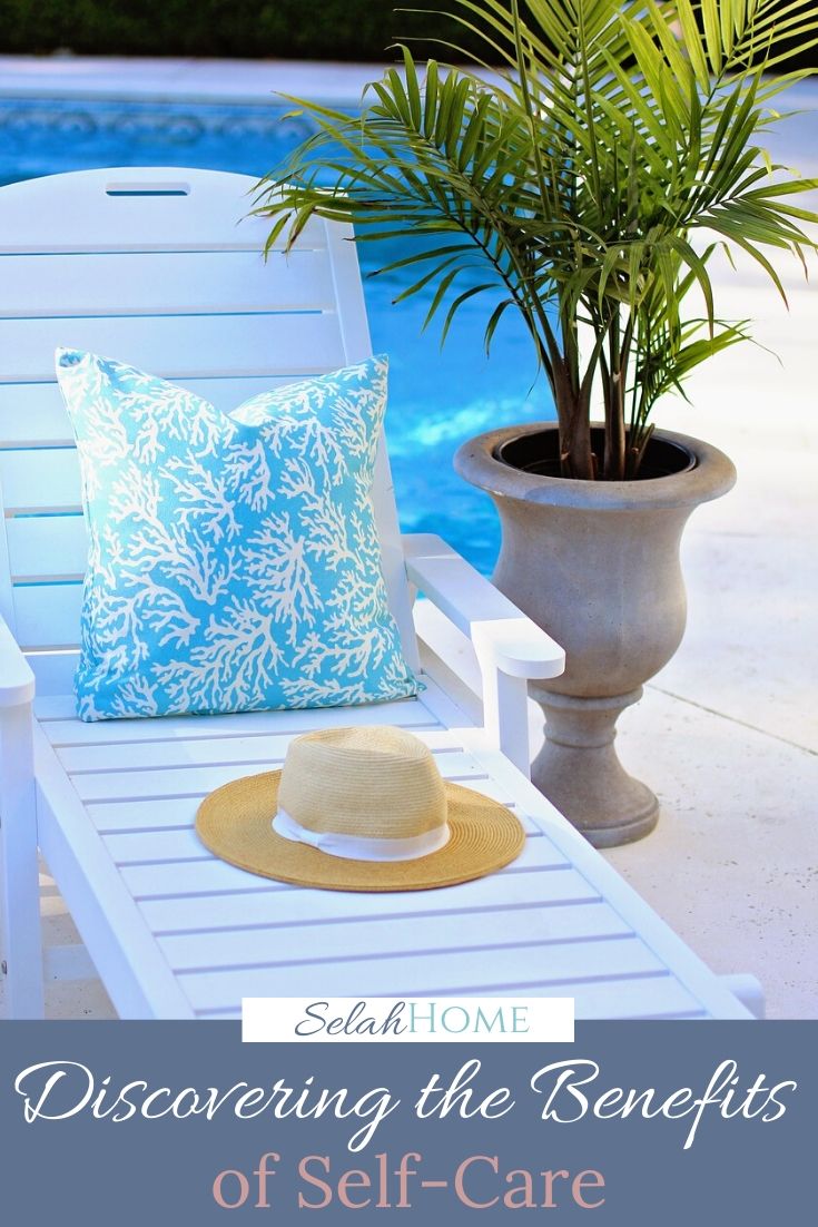 A Pinterest pin with a picture of a pillow and sun hat sitting on a chaise lounge by a pool. Designed for this post about the benefits of self-care.