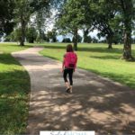 A Pinterest pin with a picture of a girl with a backpack walking down the sidewalk. Designed for this post about letting go on the first day of kindergarten.