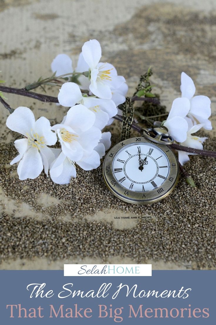 A Pinterest pin with a picture of a pocket watch and white flowers in the sand. Designed for this post about making the most of family moments.