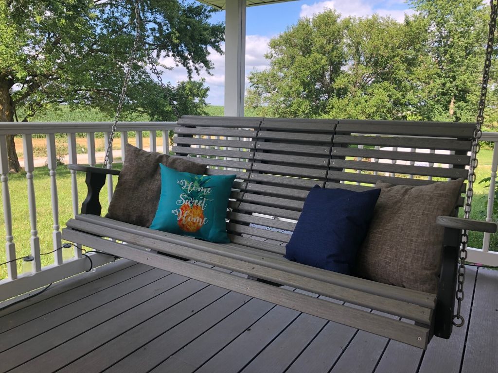A picture of a porch swing on a summer day for this post of tips to make a family sabbath possible.