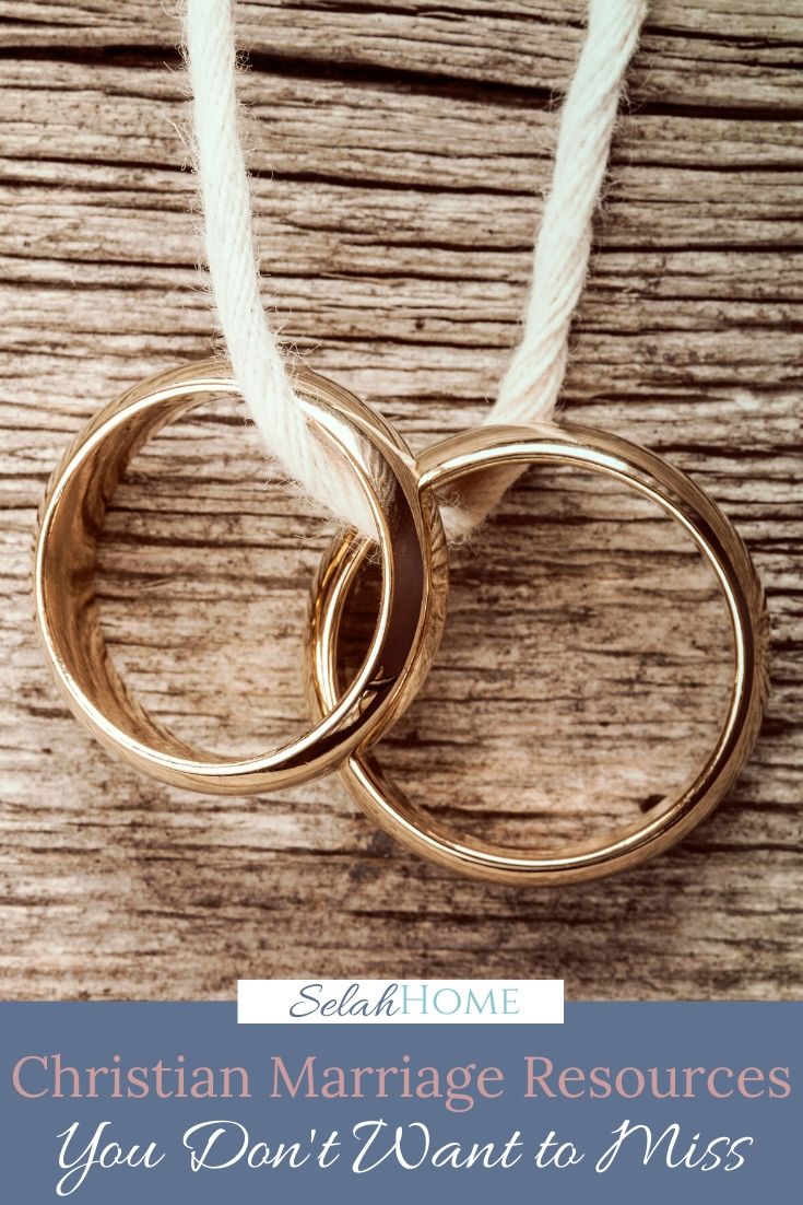 A Pinterest pin with a picture of a pair of wedding rings. Designed for this post of marriage resources.