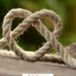 A Pinterest pin with a picture of a rope twisted into a heart. Designed for this post about a beautiful example of compassion.