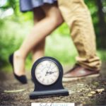 A Pinterest pin with a picture of a couple dancing outside beside a clock. Designed for this post about simple and inexpensive date nights for parents.