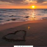 A Pinterest pin with a picture of a heart drawn in the sand at sunset. Designed for this post about investing in marriage by getting away together.