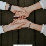 A Pinterest pin with a picture of a couple holding hands. Designed for this post about the importance of prayer in marriage.