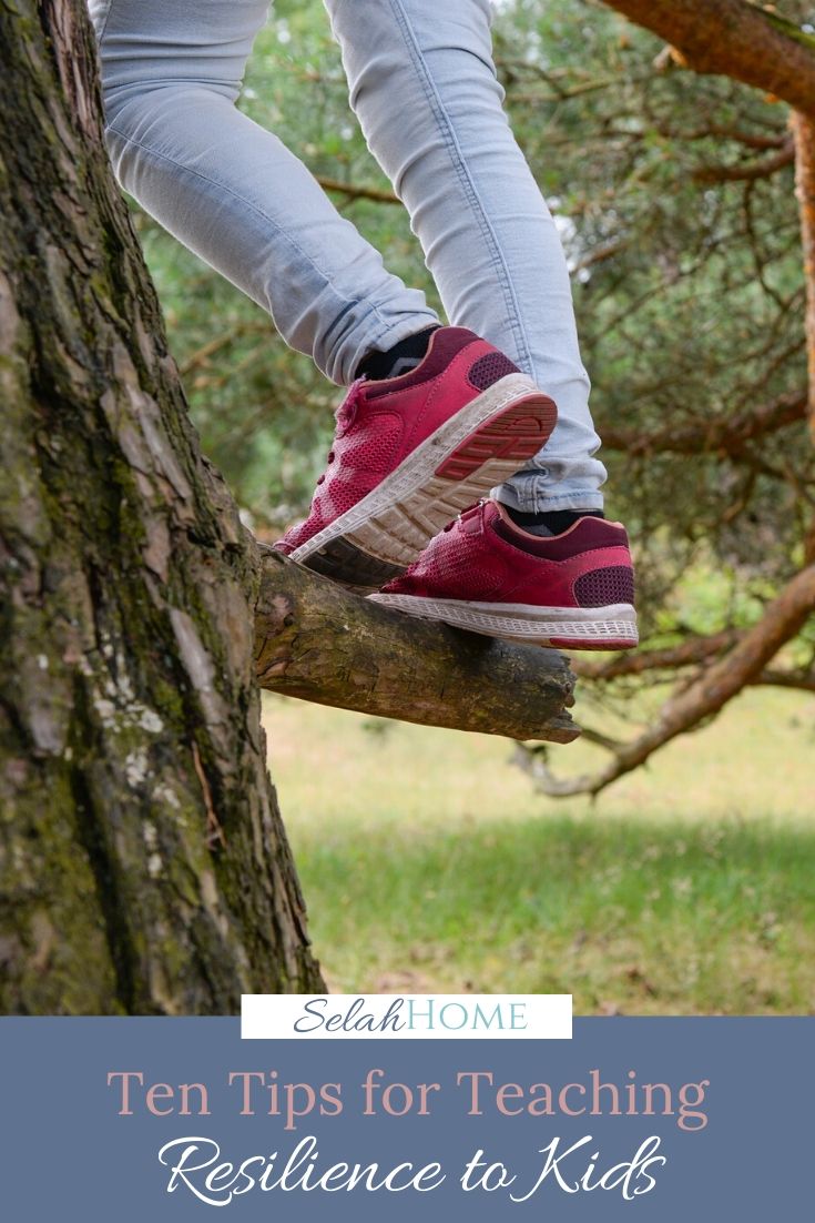A Pinterest pin with a picture of a child climbing a tree. Designed for this post of tips for teaching resilience to kids.