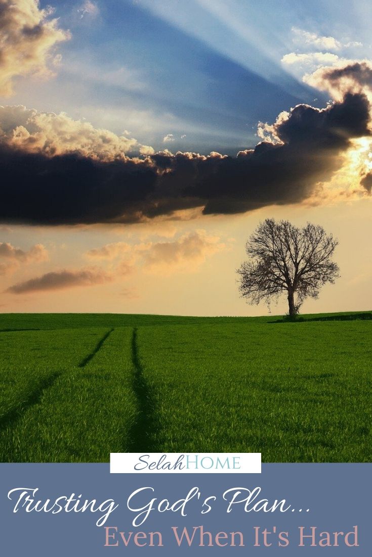 A Pinterest pin with a picture of a country road and a tree at sunset. Designed for this post about yielding to God.