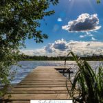 A Pinterest pin with a picture of a dock stretching into a lake under a sunlit sky. Designed for this post about how nothing is impossible with God.