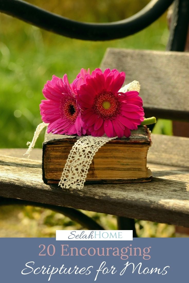 A Pinterest pin with a picture of an old Bible and pink flowers sitting on a bench. Designed for this post of scriptures for moms.