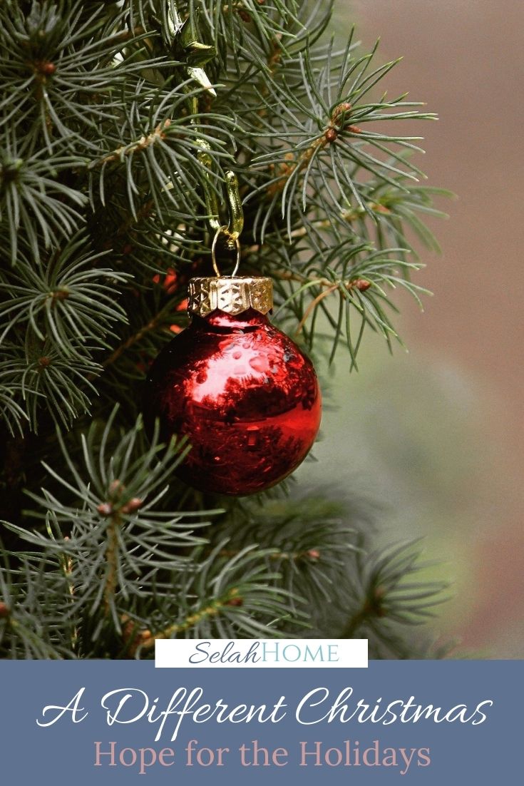 A Pinterest pin with a picture of a Christmas tree. Designed for this post about a different Christmas.