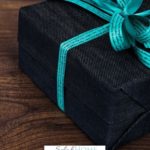 A Pinterest pin with a picture of a wrapped present. Designed for this post about gifts from the heart.