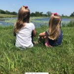 A Pinterest pin with a picture of two little girls looking out over a pond. Designed for this post about a childlike heart.