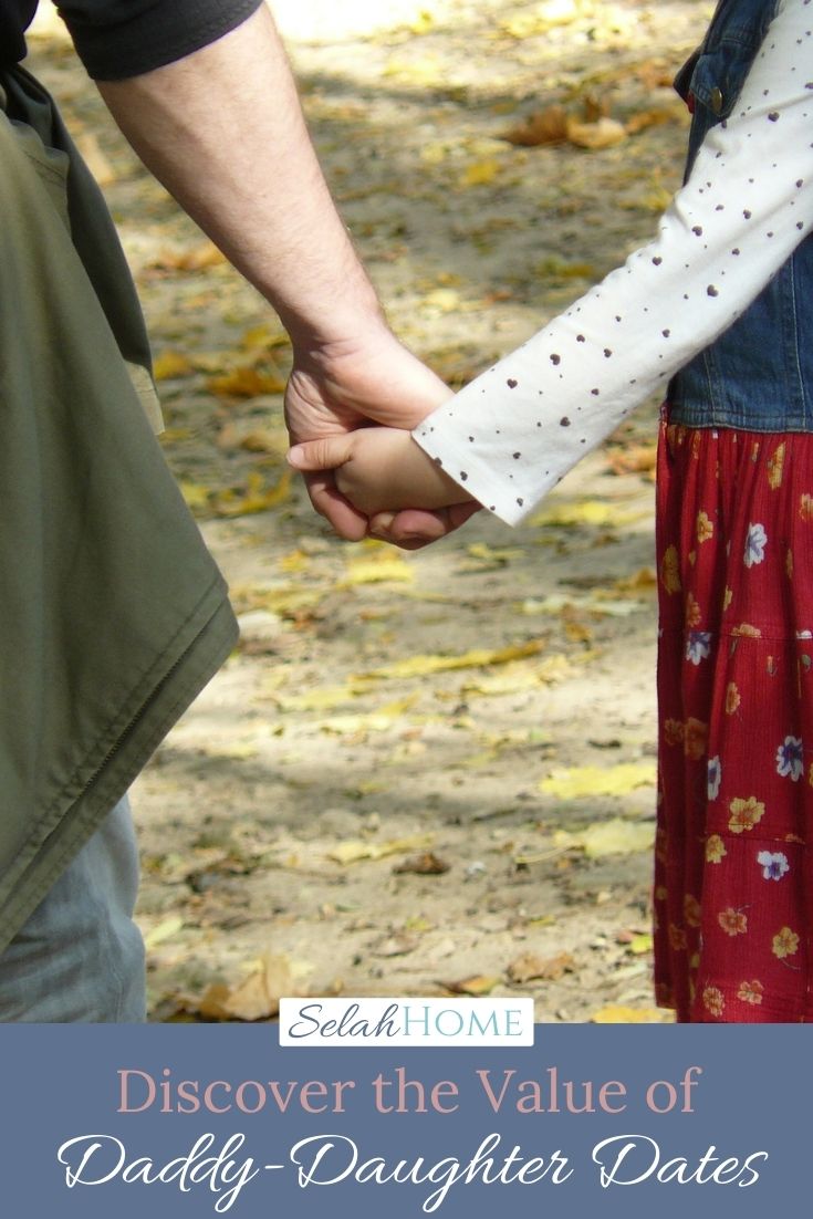 A Pinterest pin with a picture of a father and daughter holding hands. Designed for this post about the value of daddy daughter dates.