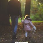 A Pinterest pin with a picture of a father and daughter taking a walk. Designed for this post of daddy-daughter date ideas.