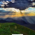 A Pinterest pin with a picture of a mountain sunrise. Designed for this post about seeing God through nature.