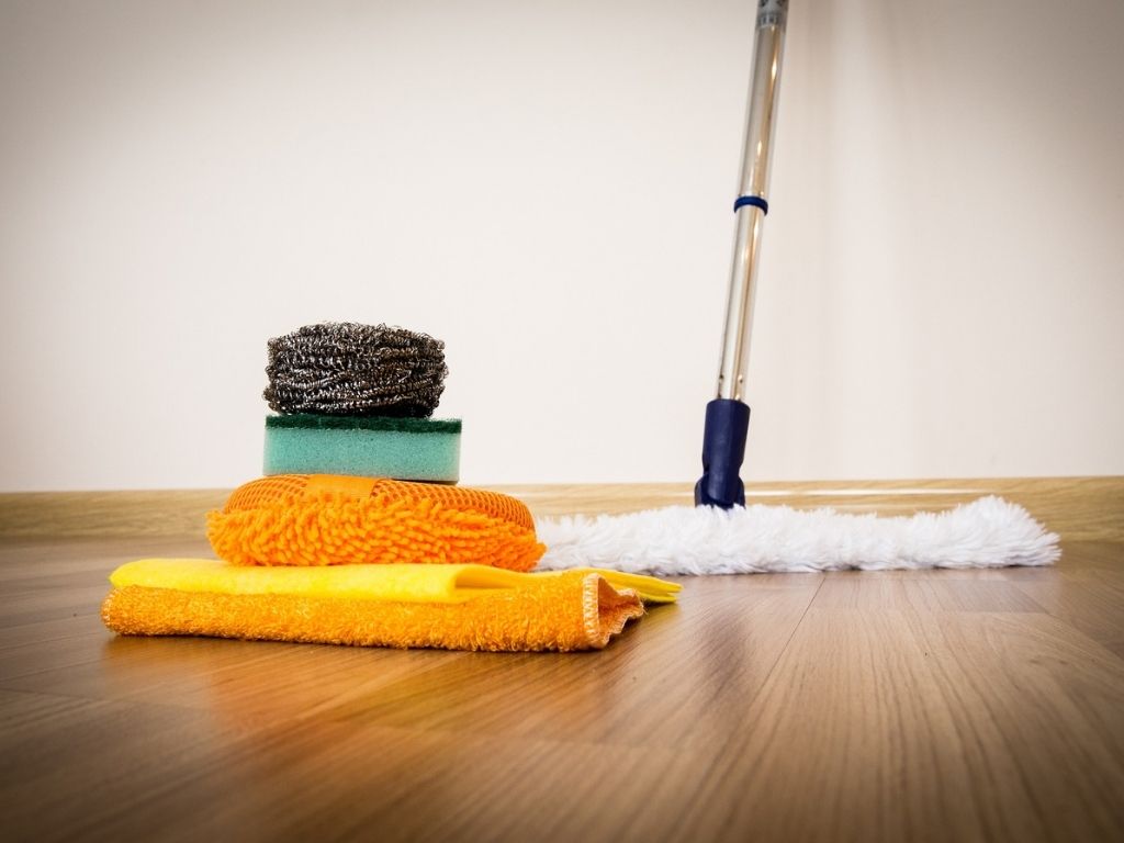 A picture of cleaning supplies for this post about the benefits of doing household chores for kids.