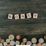 A Pinterest pin with a picture of a pile of coins. Designed for this post about money issues in marriage.