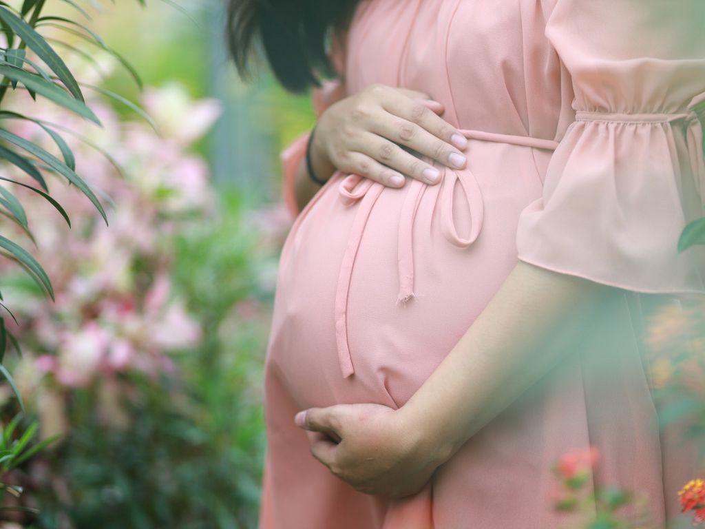 A picture of a pregnant woman for this post about a healthy mom and baby.