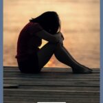 A Pinterest pin with a picture of a woman sitting with her head on her knees. Designed for this post about how to deal with anxiety as a Christian.