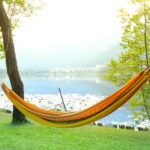 A picture of a hammock by the water for this post about how to have a tech free day.