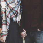 A picture of a couple holding hands for this post of strong marriage quotes.