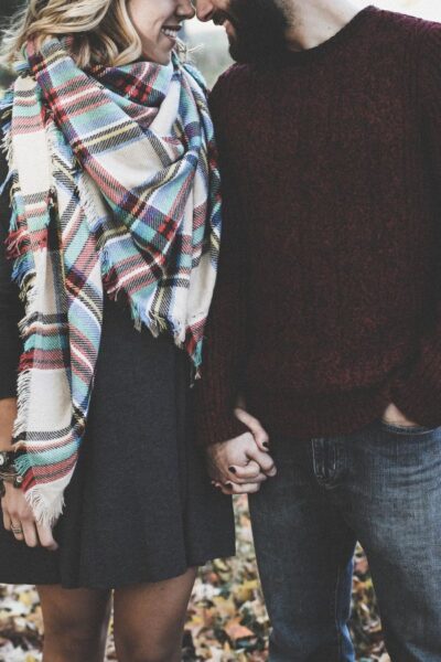 A picture of a couple holding hands for this post of strong marriage quotes.